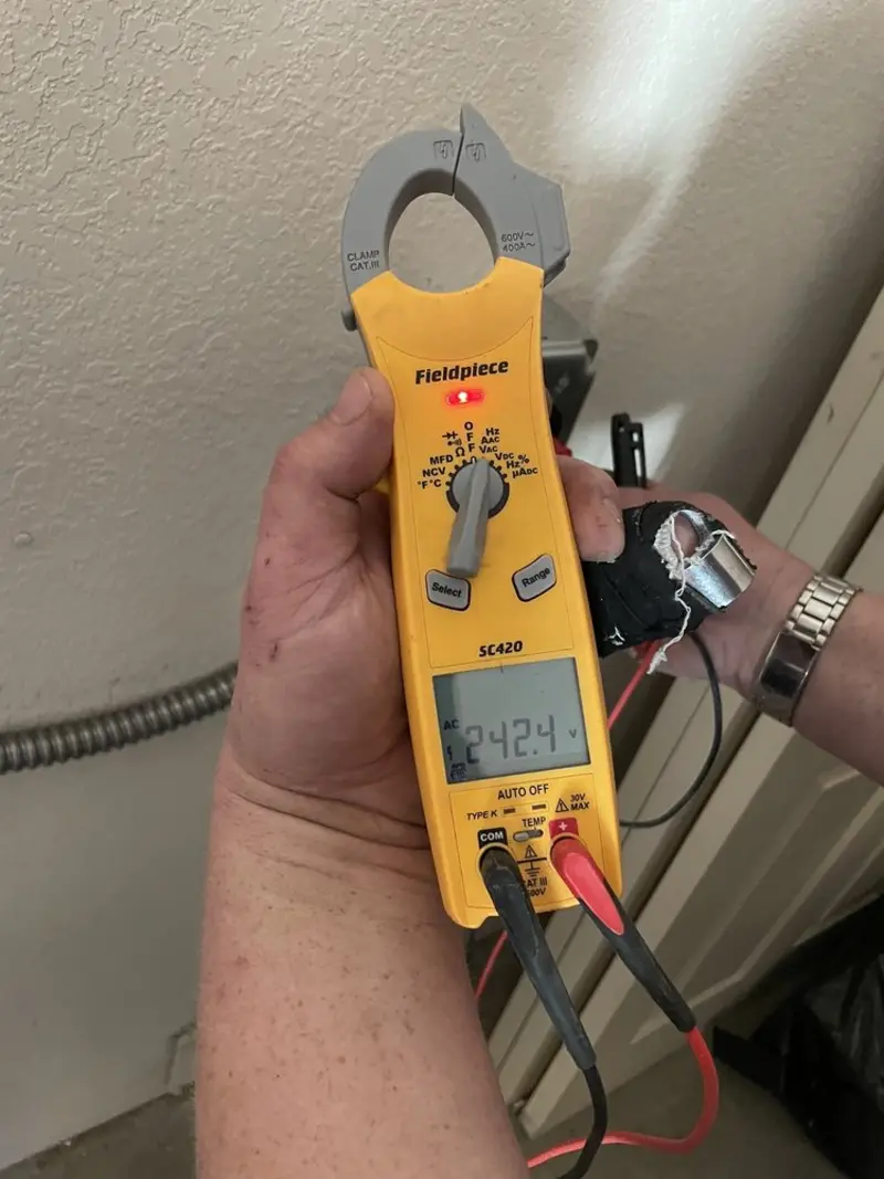 Voltage testing with clamp meter during Recessed Lighting Installation in Ballwin